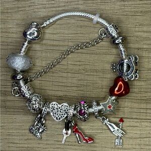 Pandora Bracelet 925 Silver Ale + assorted charms + original Pandora bag.